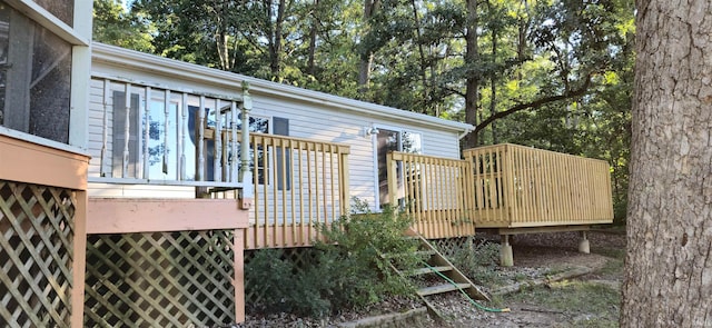 view of side of home with a wooden deck