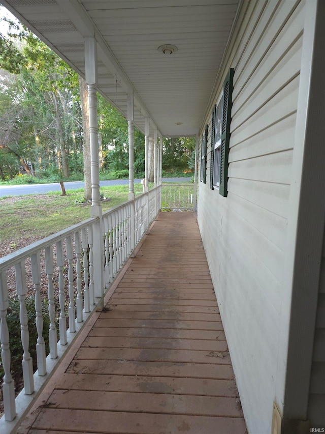 wooden terrace with a porch