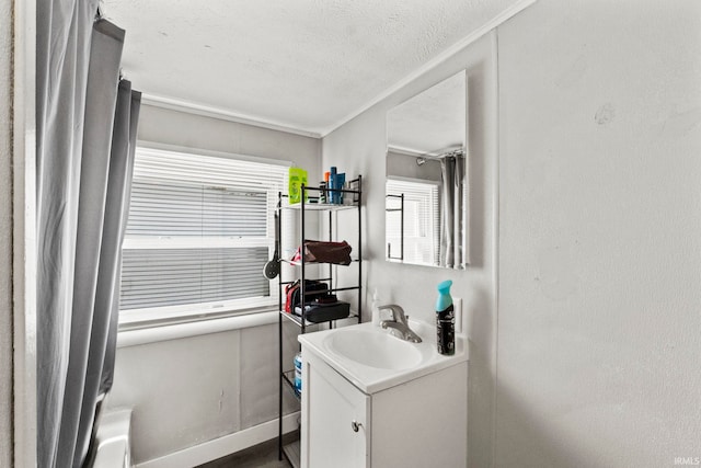 bathroom featuring vanity, a textured ceiling, and shower / bath combination with curtain