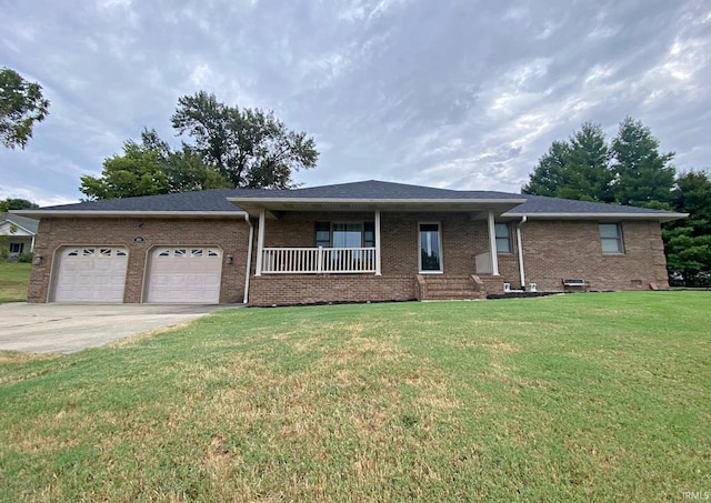 ranch-style house featuring a front lawn, a garage, and covered porch