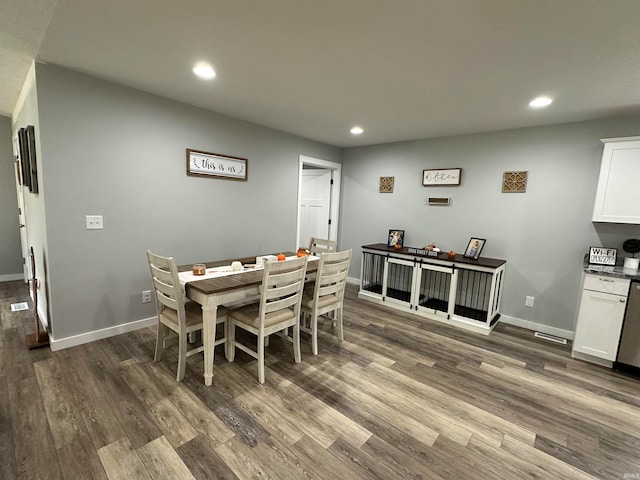 dining space featuring dark hardwood / wood-style floors