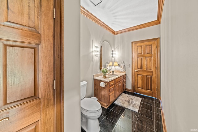 bathroom featuring crown molding, vanity, toilet, and tile patterned flooring