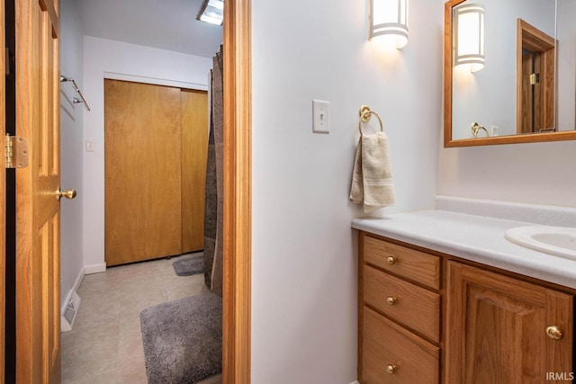 full bathroom featuring vanity and tile patterned floors