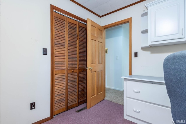 home office featuring carpet floors, visible vents, crown molding, and baseboards