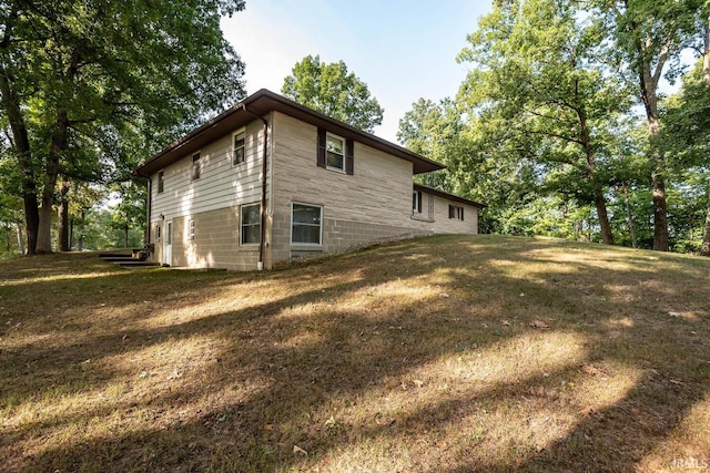 view of home's exterior featuring a lawn