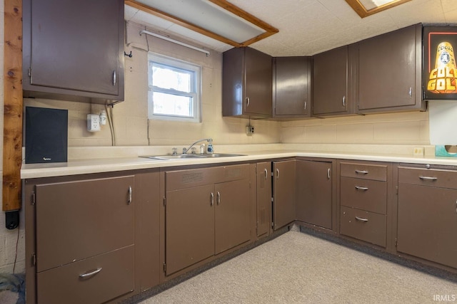 kitchen with light countertops and a sink