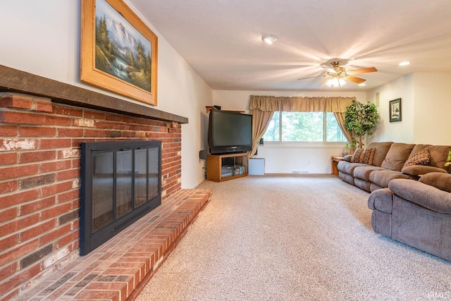 carpeted living area featuring a ceiling fan and a fireplace