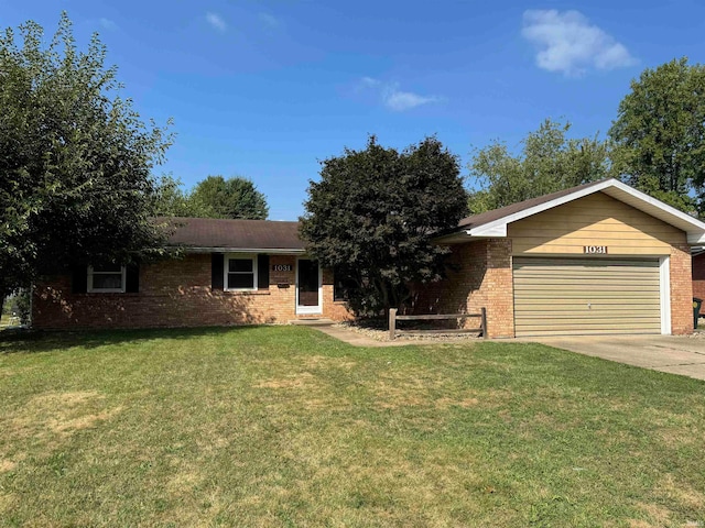 ranch-style house with a garage and a front yard