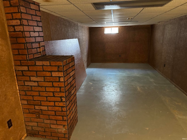 basement featuring a drop ceiling