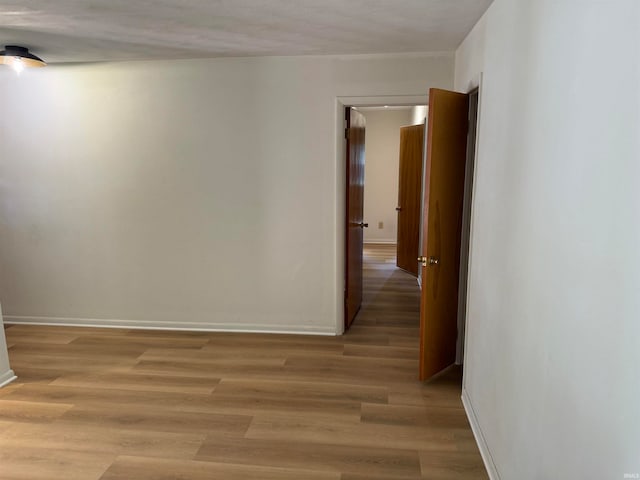 spare room featuring light wood-type flooring