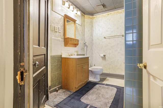 bathroom with visible vents, toilet, and vanity