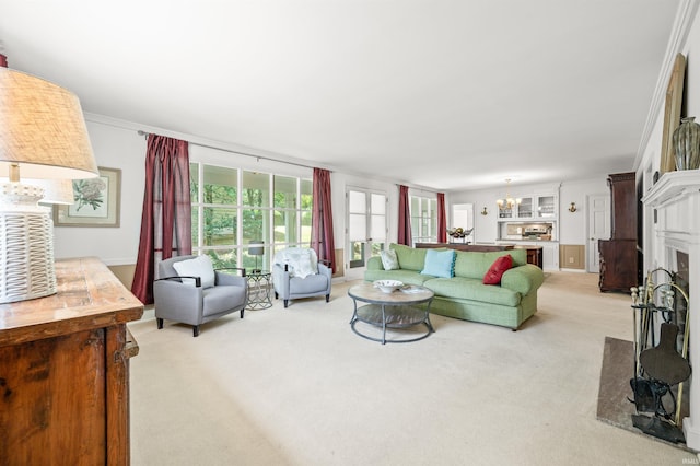 carpeted living room featuring ornamental molding