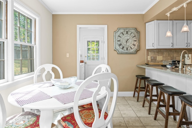 tiled dining space with crown molding