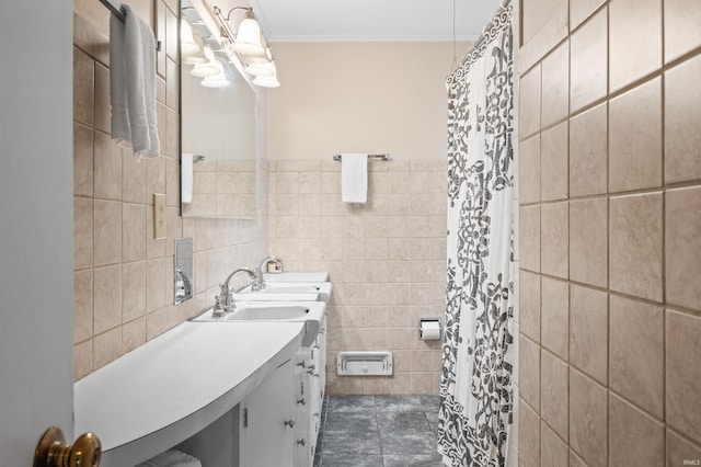 bathroom with tile patterned floors, tile walls, crown molding, and vanity