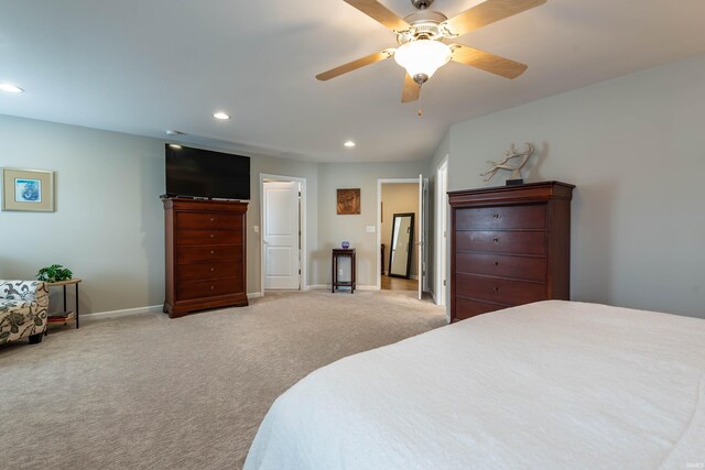 bedroom featuring ceiling fan and carpet