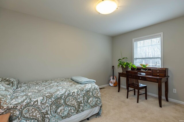 bedroom featuring light colored carpet