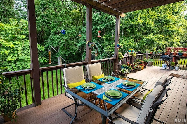 wooden terrace with a yard