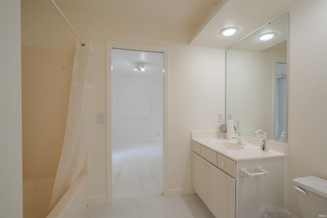 full bathroom with tile patterned flooring, toilet, shower / tub combo with curtain, and vanity