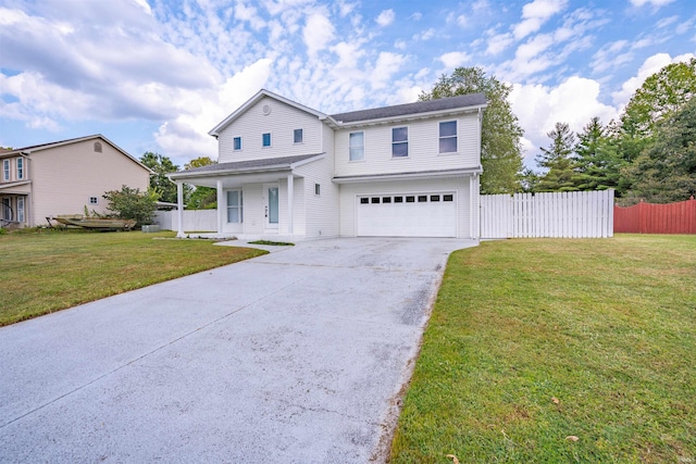 traditional home featuring roof with shingles, fence, an attached garage, driveway, and a front lawn