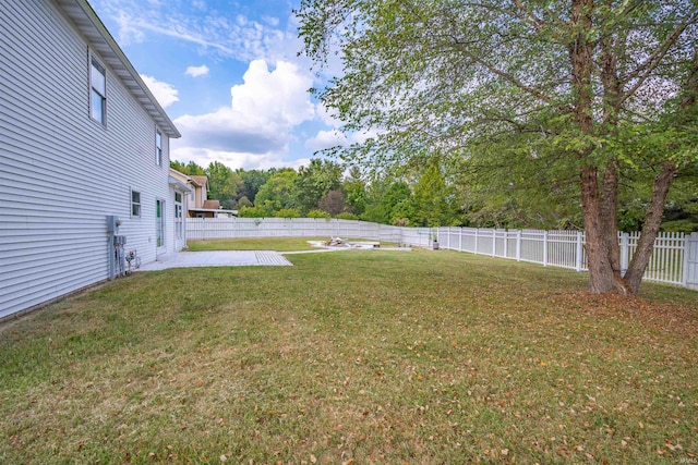 view of yard with a fenced backyard and a patio area