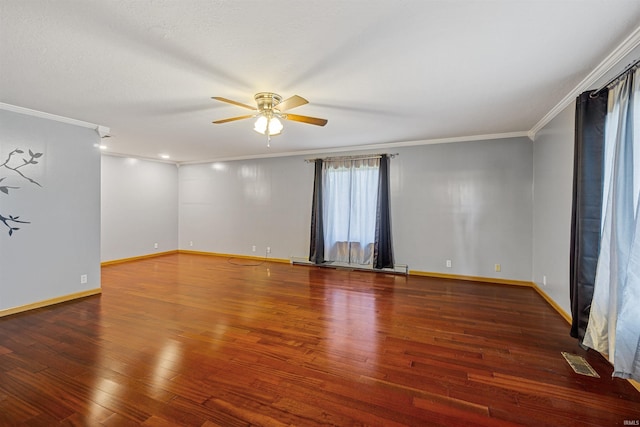 spare room featuring crown molding, ceiling fan, and dark hardwood / wood-style floors