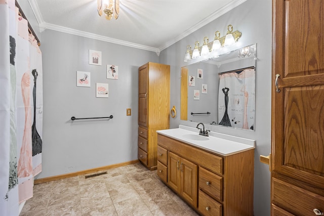 bathroom with vanity, ornamental molding, and tile patterned floors