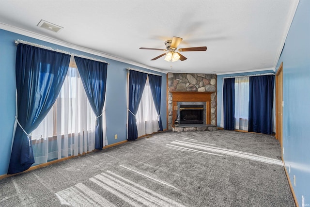 unfurnished living room featuring carpet flooring, ceiling fan, a fireplace, and ornamental molding