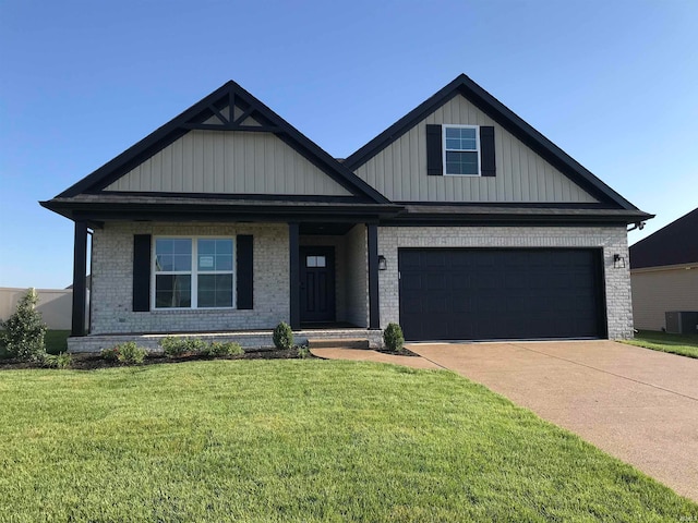 craftsman inspired home featuring a front yard, brick siding, driveway, and an attached garage