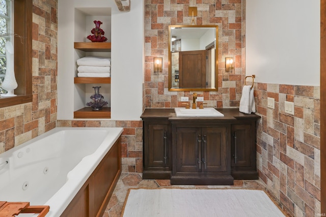 bathroom with vanity and a bathtub