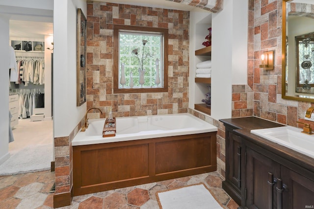 bathroom featuring a tub and vanity