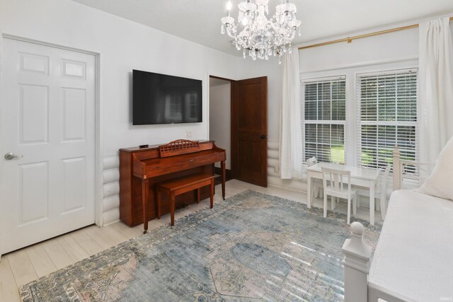 interior space with a chandelier and light hardwood / wood-style flooring