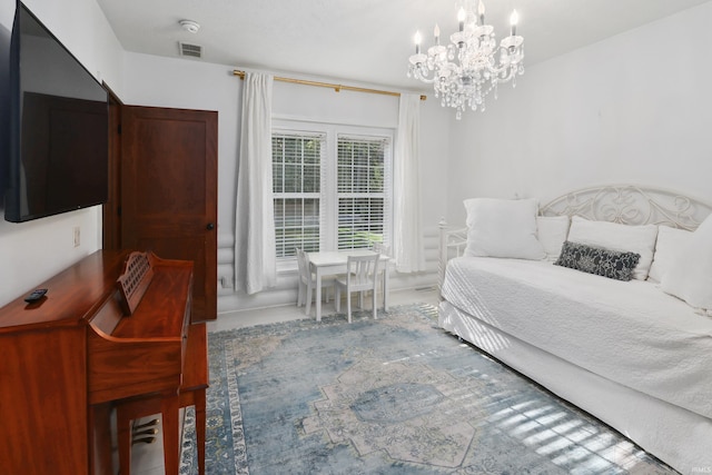 bedroom with an inviting chandelier