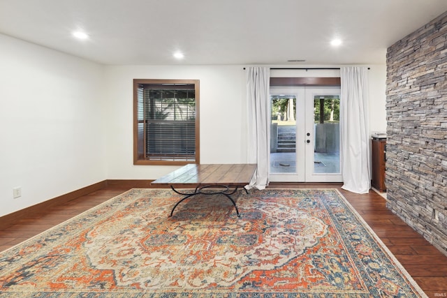 sitting room with dark hardwood / wood-style flooring and french doors