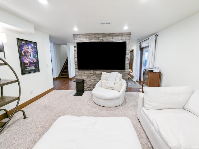 living room featuring a fireplace and dark hardwood / wood-style floors