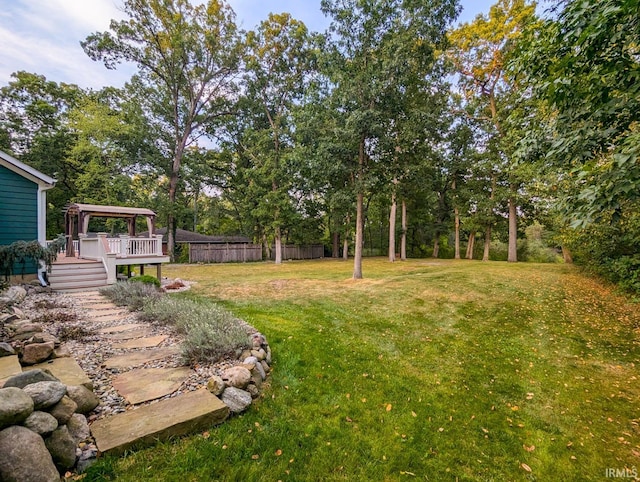 view of yard with a deck and a gazebo