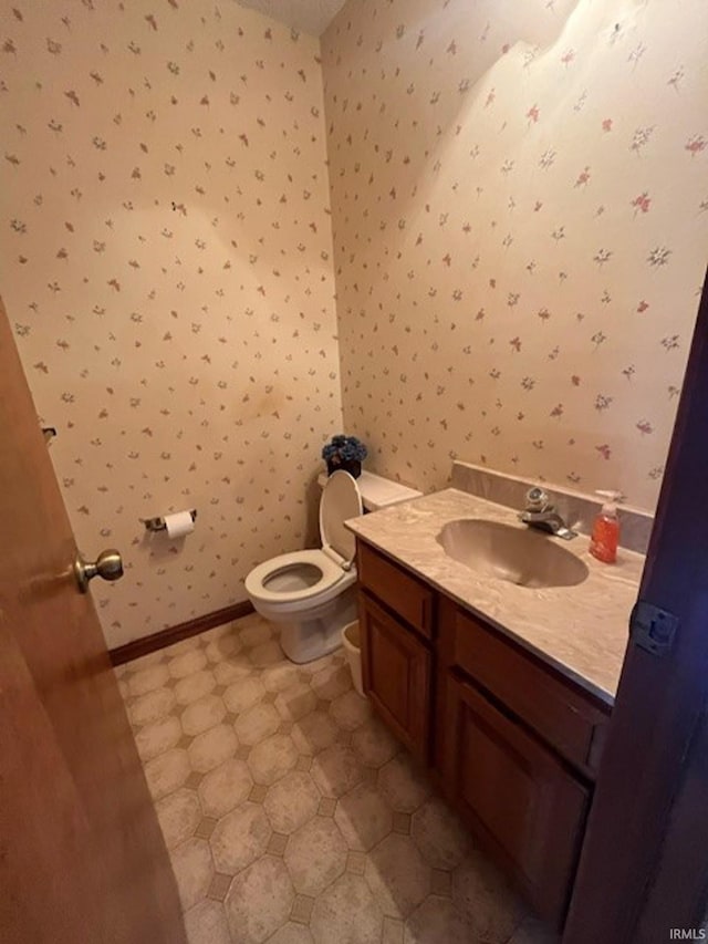 bathroom with toilet and vanity