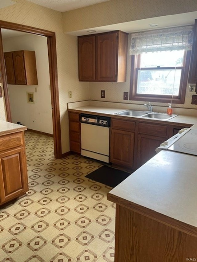 kitchen with sink and white appliances