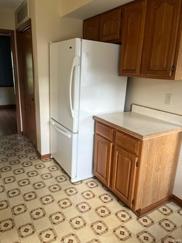 kitchen featuring white fridge