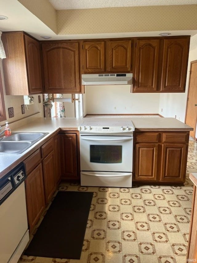 kitchen with white appliances and sink