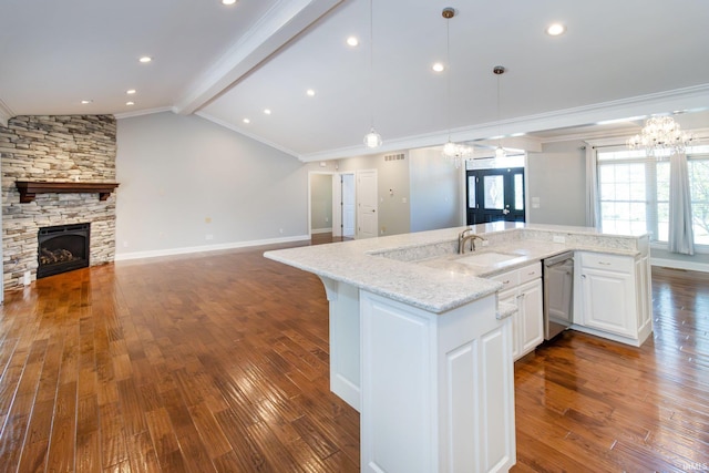 kitchen featuring wood-type flooring, decorative light fixtures, an inviting chandelier, and white cabinets