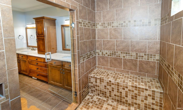 bathroom with tile patterned floors, ornamental molding, and vanity