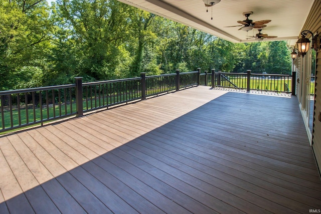 wooden terrace featuring ceiling fan