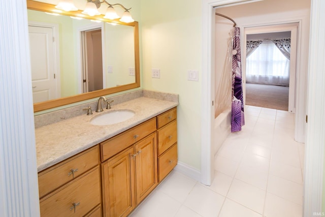 bathroom featuring vanity, shower / bath combo, and tile patterned flooring