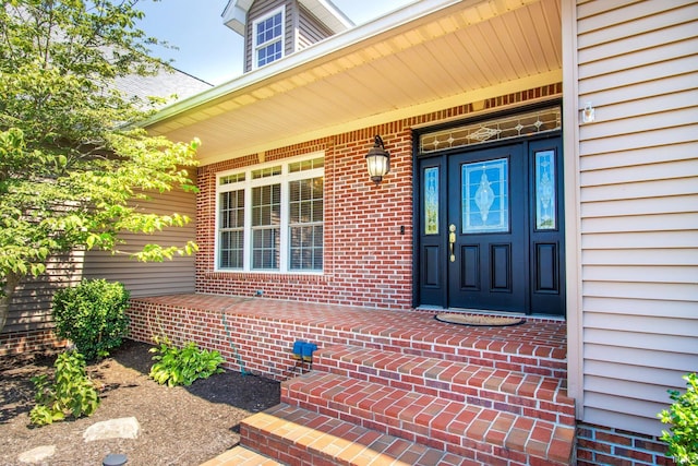 property entrance with covered porch