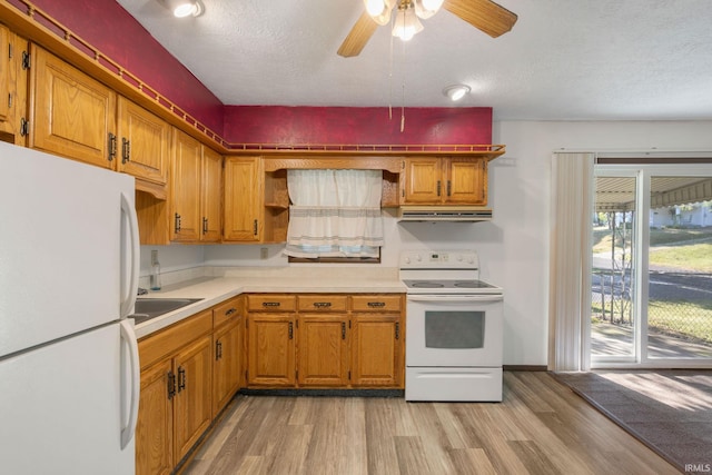 kitchen featuring a textured ceiling, light hardwood / wood-style flooring, ceiling fan, and white appliances