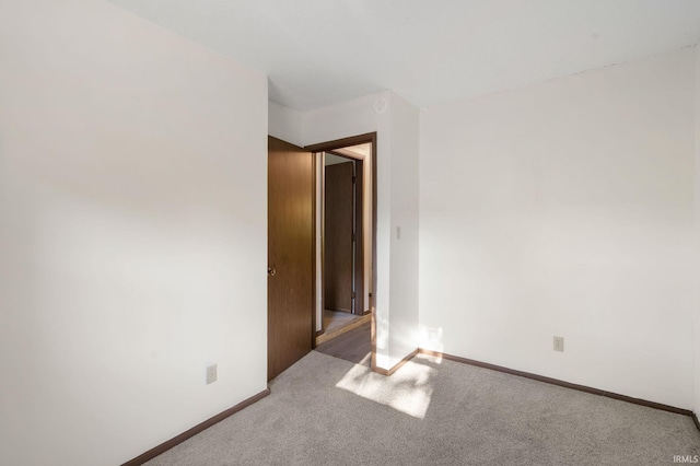 unfurnished room featuring carpet