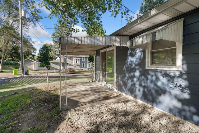 view of home's exterior featuring an outbuilding and a garage