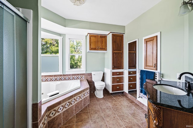 full bathroom featuring tile patterned flooring, vanity, toilet, and plus walk in shower