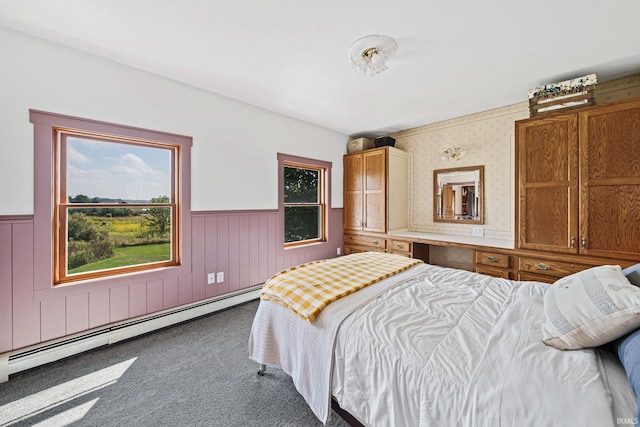 bedroom featuring a baseboard radiator and dark carpet