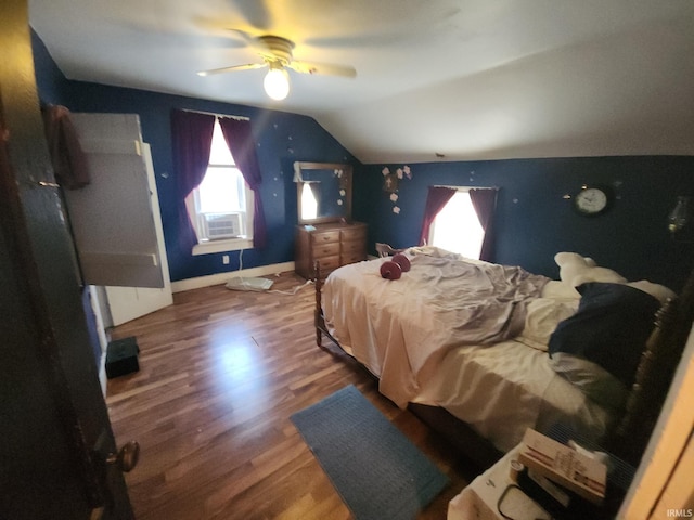 bedroom featuring vaulted ceiling, hardwood / wood-style flooring, and ceiling fan